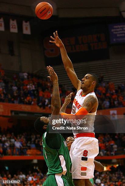 Fab Melo of the Syracuse Orange shoots the ball while being defended by Robert Goff of the Marshall Thundering Herd during the game at the Carrier...