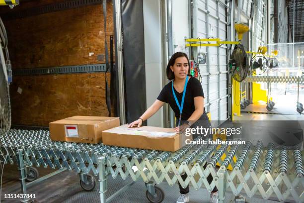warehouse worker loading boxes into truck - warehouse loading stock pictures, royalty-free photos & images