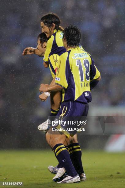 Yuki Abe of JEF United Chiba celebrates scoring his side's second goal with his team mates Takenori Hayashi and Seiichiro Maki during the J.League...