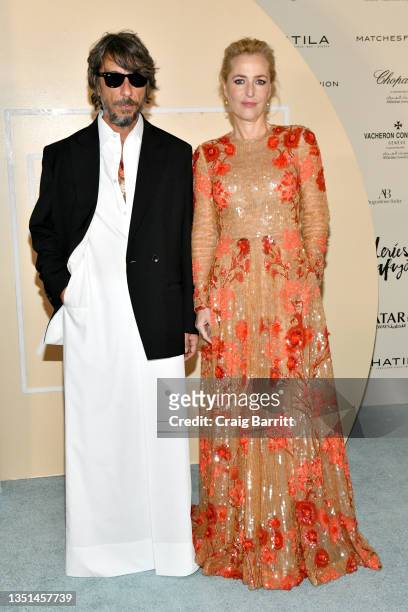 Pierpaolo Piccioli and Gillian Anderson attend the Fashion Trust Arabia Prize Gala on November 3, 2021 at the National Museum of Qatar in Doha. The...
