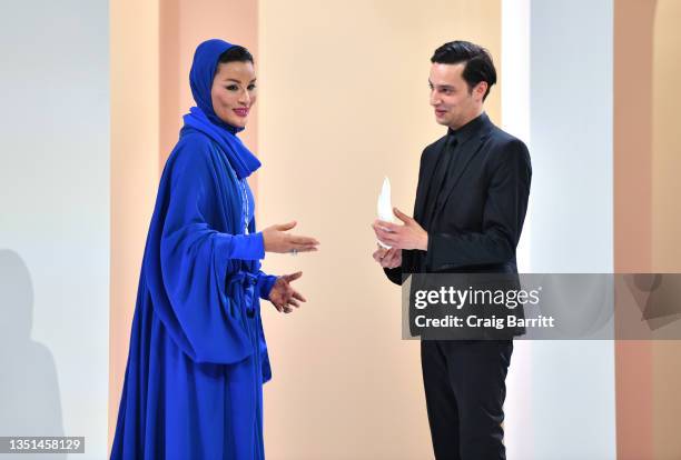 Her Highness Sheikha Moza bint Nasser and Mohamed Benchellal appear onstage at the Fashion Trust Arabia Prize Gala on November 3, 2021 at the...