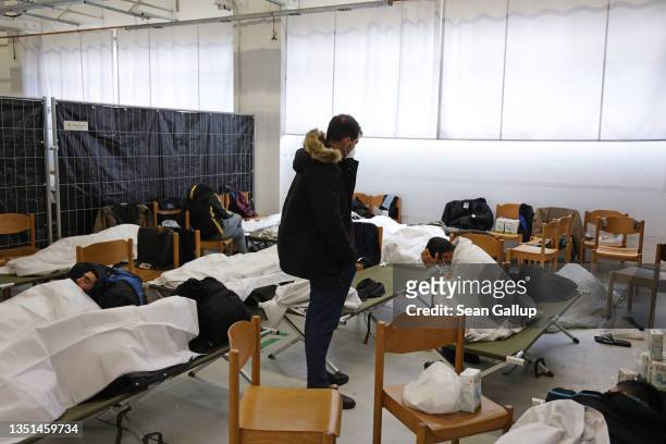 Migrants who had arrived at the German-Polish border border rest while being processed at a newly-opened federal police facility on November 05, 2021...