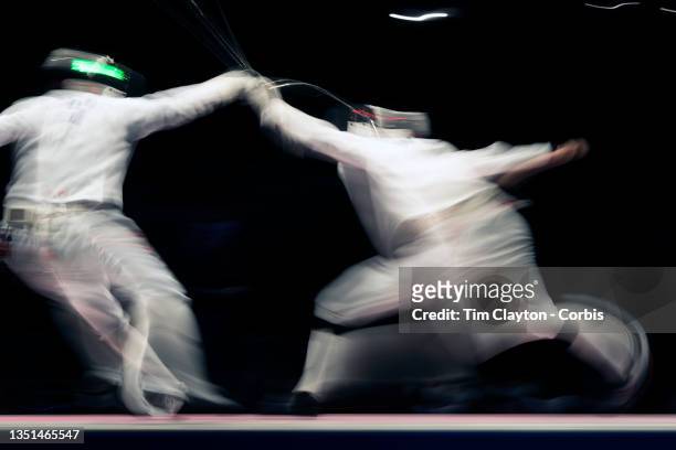 Blur of motion as fencers from China and Korea take part in the bronze medal match during the fencing epee team event for men at the Makuhari Messe...