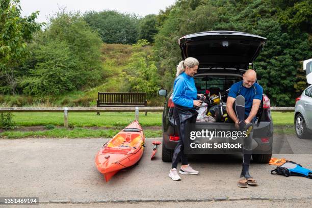 getting dressed for a day on the water - married car stock pictures, royalty-free photos & images