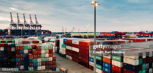 an aerial view of shipping containers stacked up in a port - stock photo - hamburg hafen stock-fotos und bilder