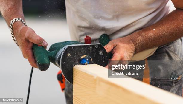 craftsman working with the electric hand milling machine - wood accuracy stock pictures, royalty-free photos & images