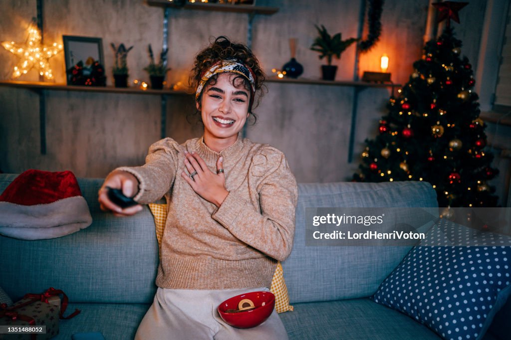 Woman watching tv at home
