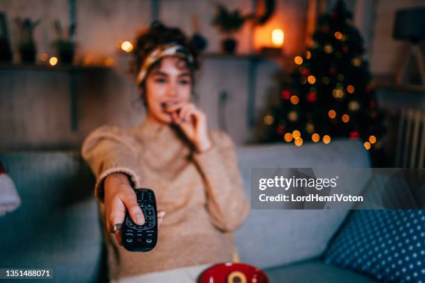 woman watching tv at home - binge watching stock pictures, royalty-free photos & images