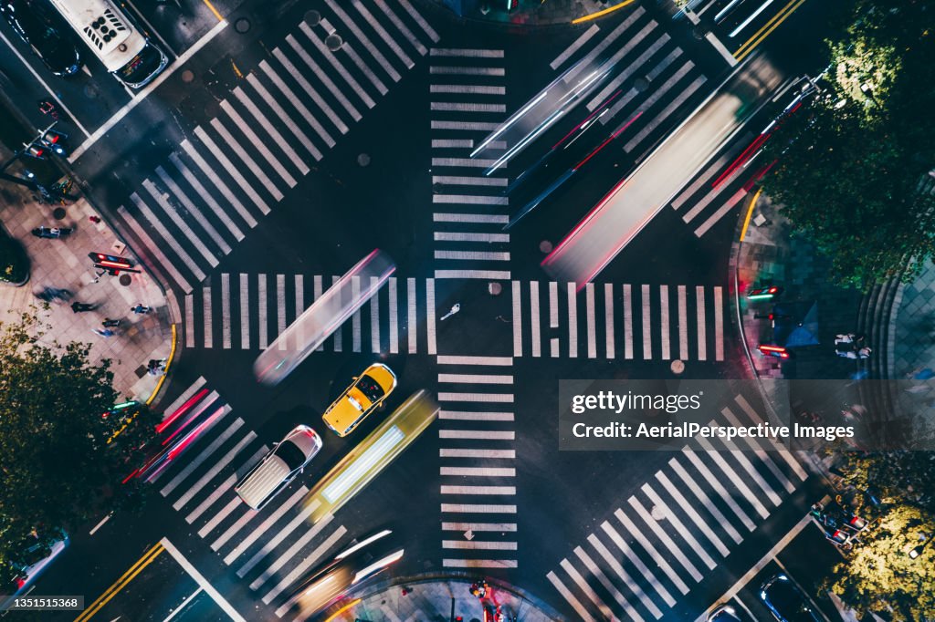 Drone View of City Street Crossing at Night