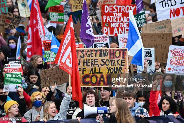 Demonstrators join the Fridays For Future march on November 05, 2021 in Glasgow, Scotland. Day Six of the 2021 climate summit in Glasgow will focus...