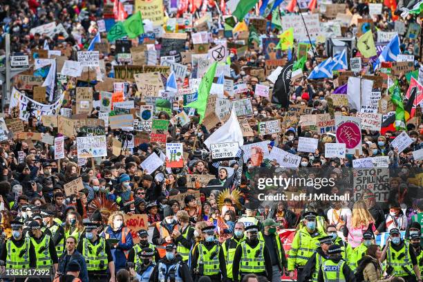Demonstrators join the Fridays For Future march on November 05, 2021 in Glasgow, Scotland. Day Six of the 2021 climate summit in Glasgow will focus...