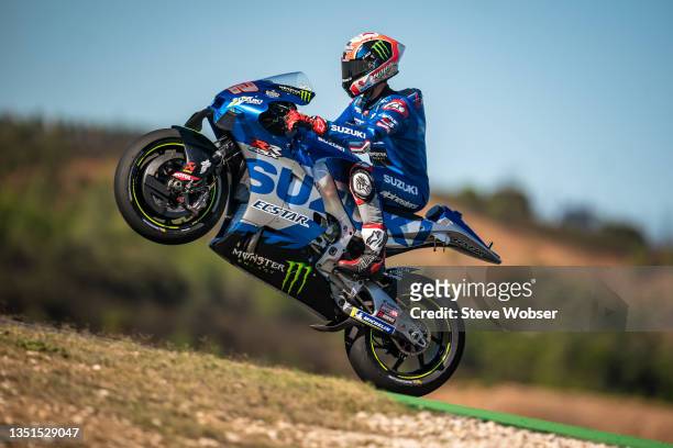 Alex Rins of Spain and Team SUZUKI ECSTAR rides a wheelie during free practice session of the MotoGP Grande Prémio Brembo do Algarve at Autodromo do...