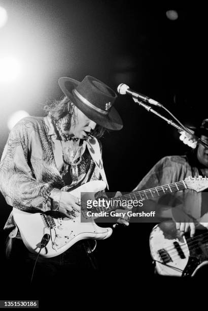 American Blues and Rock musician Stevie Ray Vaughan plays guitar as he performs onstage during the 'Soul to Soul' tour at Pier 88, New York, New...
