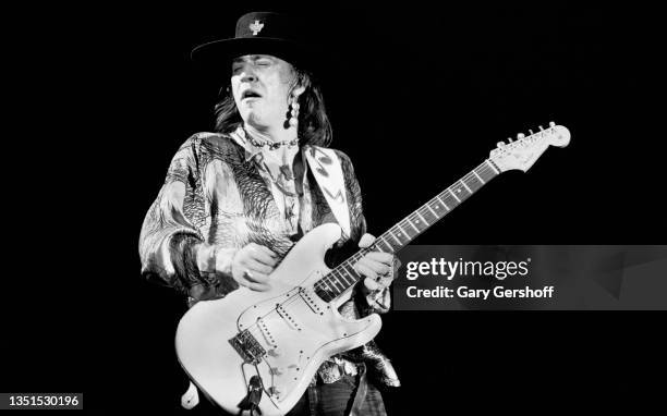 American Blues and Rock musician Stevie Ray Vaughan plays guitar as he performs onstage during the 'Soul to Soul' tour at Pier 89, New York, New...