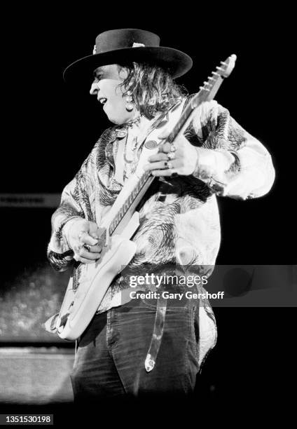 American Blues and Rock musician Stevie Ray Vaughan plays guitar as he performs onstage during the 'Soul to Soul' tour at Pier 85, New York, New...