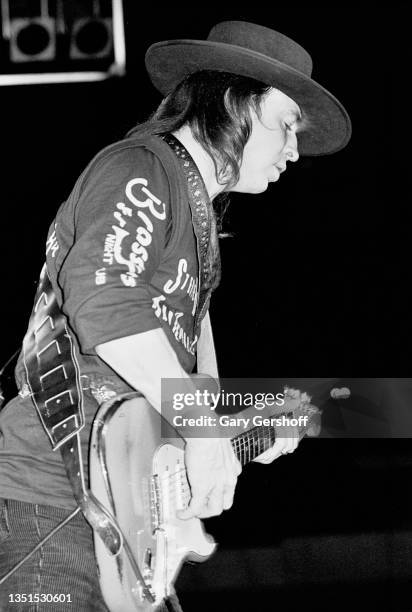 American Blues and Rock musician Stevie Ray Vaughan plays guitar as he performs onstage, with his band Double Trouble, during the 'Texas Flood' tour...