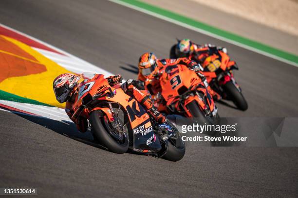 Iker Lecuona of Spain and Tech 3 KTM Factory Racing rides in front of Danilo Petrucci of Italy and Tech 3 KTM Factory Racing and Brad Binder of South...