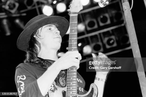 American Blues and Rock musician Stevie Ray Vaughan plays guitar as he performs onstage, with his band Double Trouble, during the 'Texas Flood' tour...