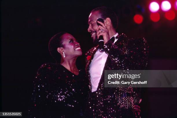 American R&B, Funk, and Soul musician Marvin Gaye performs onstage, with an unidentified woman, during the 'Sexual Healing' tour at Radio City Music...