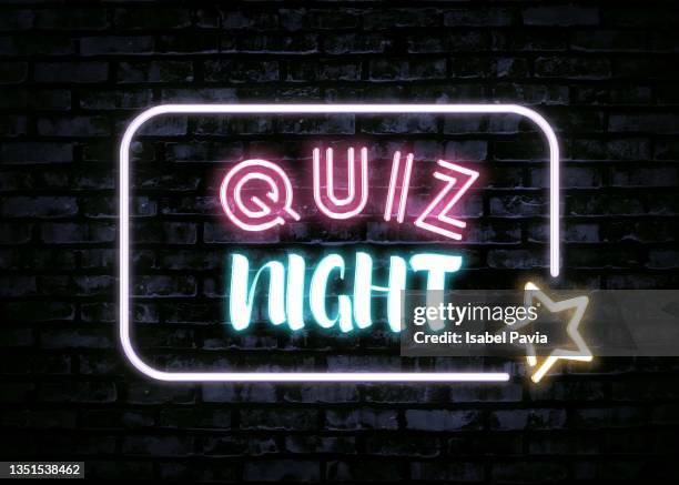 quiz night message in neon lights - quiz night stock pictures, royalty-free photos & images