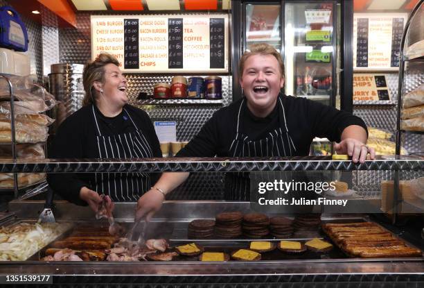 Cheery workers on the Burger Van prior to the Emirates FA Cup First Round match between AFC Sudbury and Colchester United at The MEL Group Stadium on...