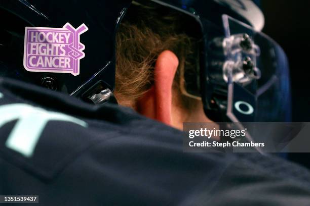 Hockey fights cancer" logo is seen on the helmet of Jamie Oleksiak of the Seattle Kraken before the game against the Buffalo Sabres on November 04,...