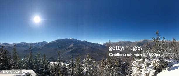 scenic view of snowcapped mountains against clear sky,lake placid,new york,united states,usa - lake placid foto e immagini stock