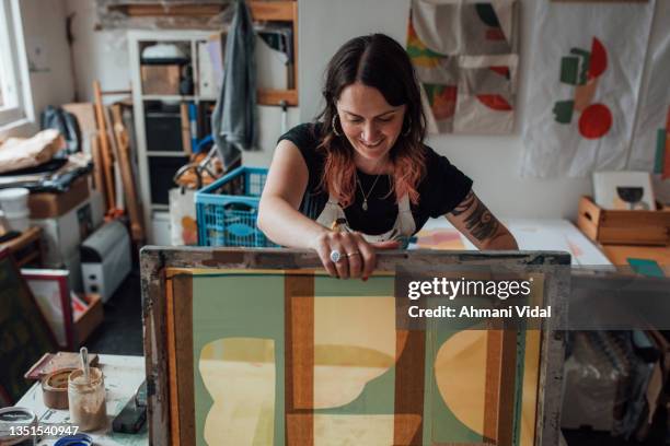 artist and printmaker working in her studio - silk screen stock pictures, royalty-free photos & images