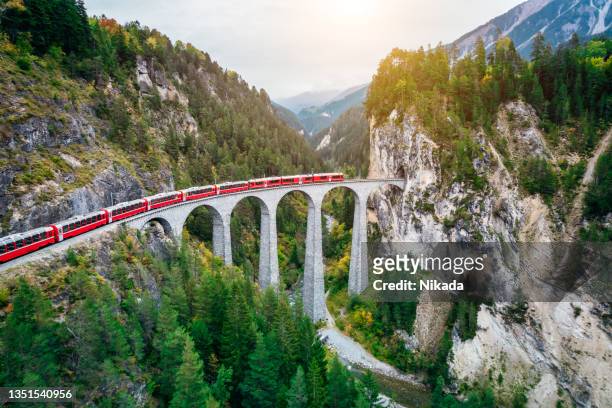 train crossing bridge, switzerland - engadin stock pictures, royalty-free photos & images