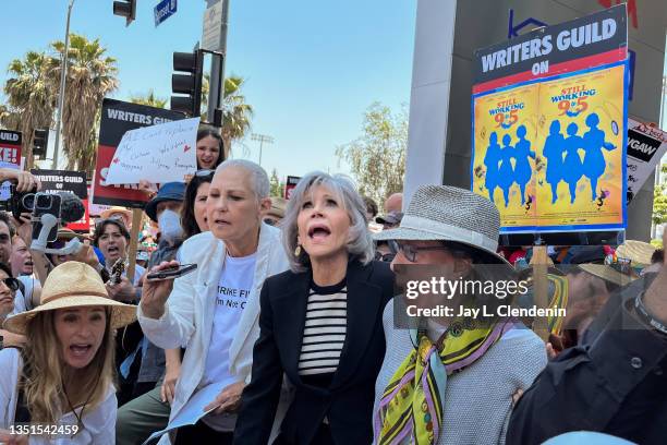 Hollywood, CA Actress and activist Jane Fonda, center in dark jacket, and her "9 to 5" co-star Lily Tomlin, right, joined by the 1980 film's...