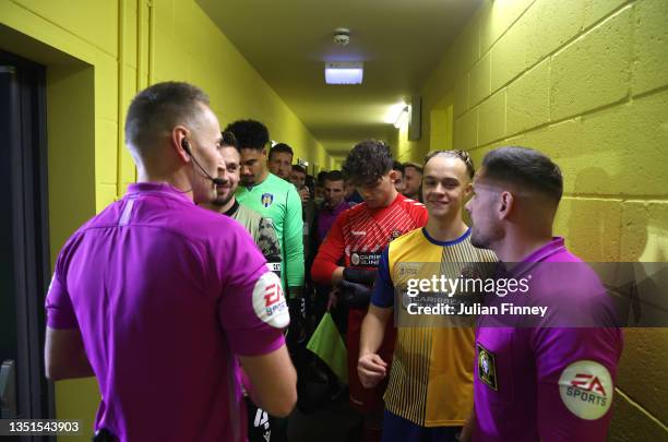 Sodbury captain Lewis O' Malley chats with the match officials in the tunnel prior to the Emirates FA Cup First Round match between AFC Sudbury and...