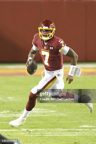 Dwayne Haskins of the Washington Football Team runs with the ball during a NFL football game against the Washington Football Team at FedExField on...
