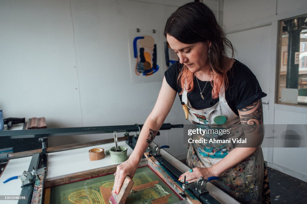 Printmaker Working Artist And Printmaker Working A Printing Press High-Res Stock Photo ...
