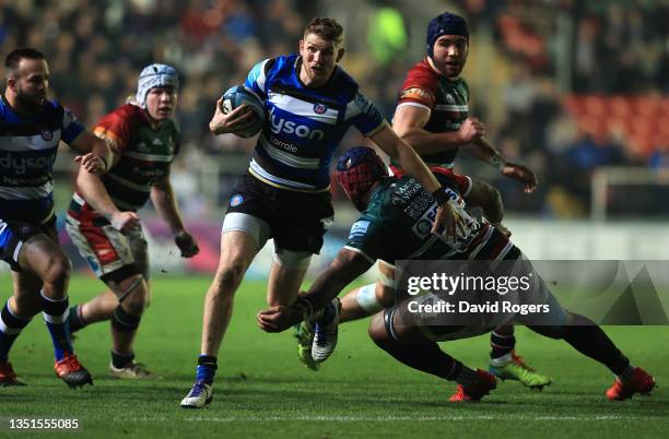 Ruaridh McConnachie of Bath Rugby breaks through the tackle from Nemani Nadolo of Leicester Tigers during the Gallagher Premiership Rugby match...