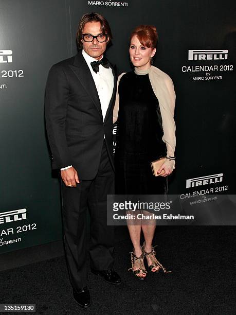 Photographer Mario Sorrenti and actress Julianne Moore attend the 2012 Pirelli Calendar gala dinner at the Park Avenue Armory on December 6, 2011 in...