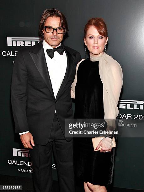 Photographer Mario Sorrenti and actress Julianne Moore attend the 2012 Pirelli Calendar gala dinner at the Park Avenue Armory on December 6, 2011 in...