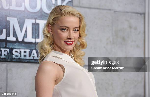 Actress Amber Heard arrives at the Los Angeles premiere of 'Sherlock Holmes: A Game Of Shadows' at Regency Village Theatre on December 6, 2011 in...