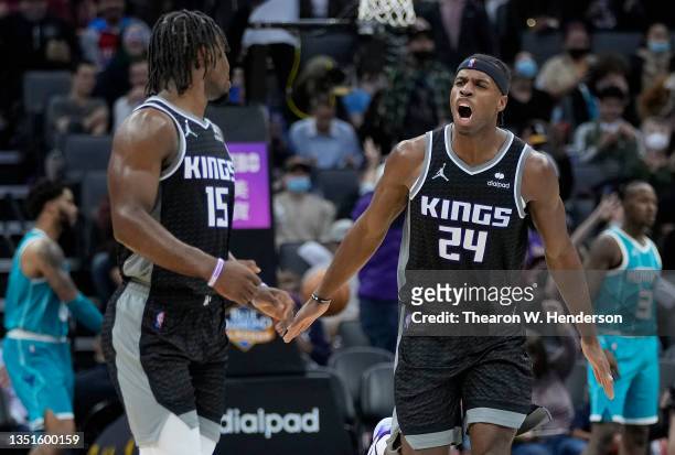 Buddy Hield of the Sacramento Kings celebrates after teammate Davion Mitchell made a three-point shot against the Charlotte Hornets during the fourth...