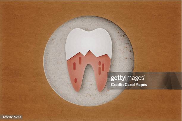 tooth made of paper work with brown background - rest cure stock-fotos und bilder