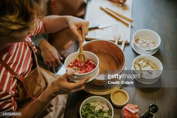 thai vlogging just put chili for making thai salad menu at home -stock photo - capsicum stock pictures, royalty-free photos & images