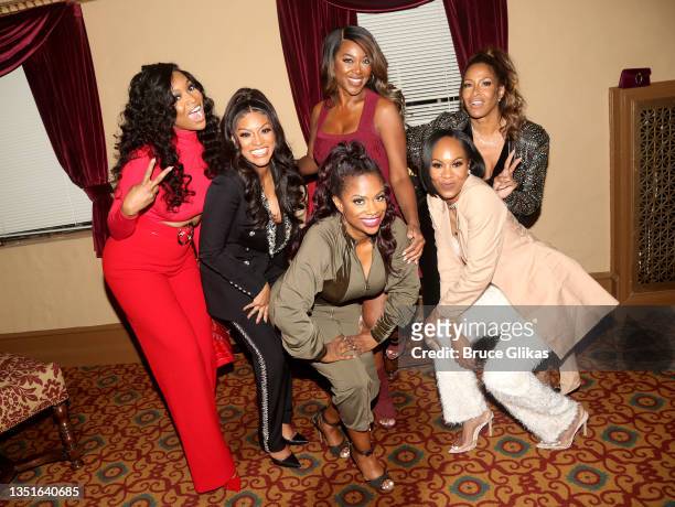 The Real Housewives of Atlanta" cast Marlo Hampton, Drew Sidora, Kandi Burruss, Kenya Moore, Sheree Whitfield and Sanya Richards-Ross pose backstage...
