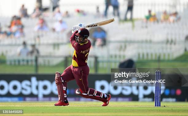 Shimron Hetmyer of West Indies plays a shot during the ICC Men's T20 World Cup match between Australia and Windies at Sheikh Zayed stadium on...