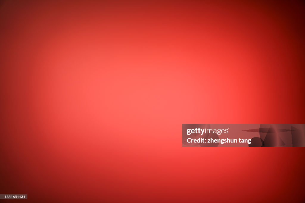 Abstract light illuminates the red background