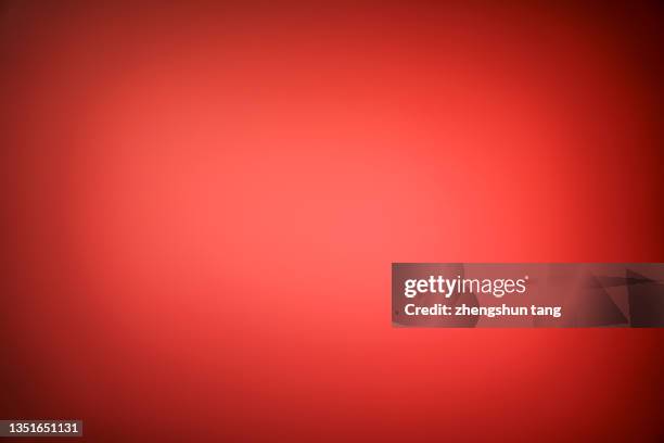 abstract light illuminates the red background - red background stock pictures, royalty-free photos & images