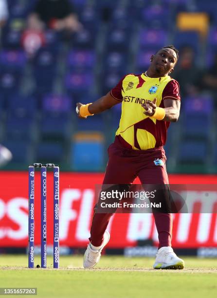 Dwayne Bravo of West Indies in bowling action during the ICC Men's T20 World Cup match between Australia and Windies at Sheikh Zayed stadium on...