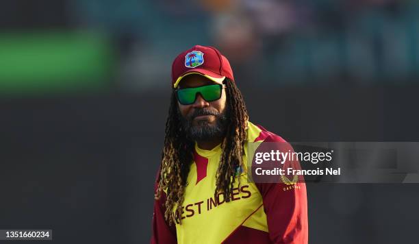 Chris Gayle of West Indies interacts with the crowd during the ICC Men's T20 World Cup match between Australia and Windies at Sheikh Zayed stadium on...