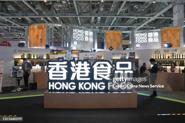 People visit the Hong Kong Food booth during the 4th China International Import Expo at the National Exhibition and Convention Center on November 5,...