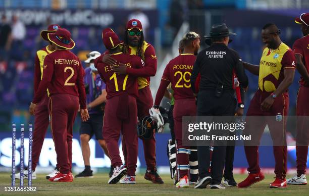 Evin Lewis and Chris Gayle of West Indies interact following the ICC Men's T20 World Cup match between Australia and Windies at Sheikh Zayed stadium...