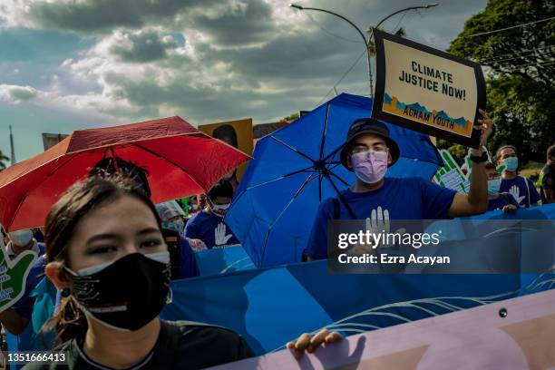 Climate activists take part in a Global Day of Action for Climate Justice protest on November 06, 2021 in Quezon city, Metro Manila, Philippines. As...