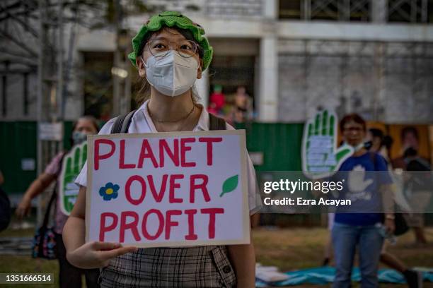 Climate activists take part in a Global Day of Action for Climate Justice protest on November 06, 2021 in Quezon city, Metro Manila, Philippines. As...